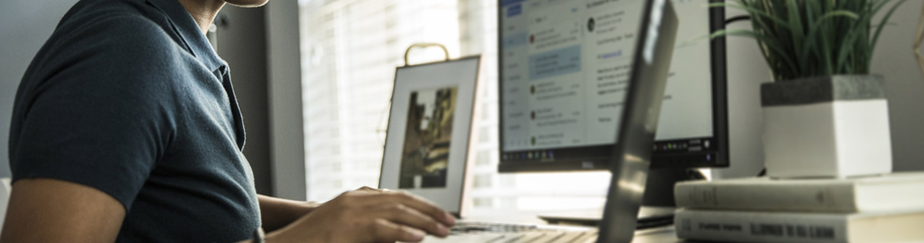 Hackathon header image lady using desktop computer